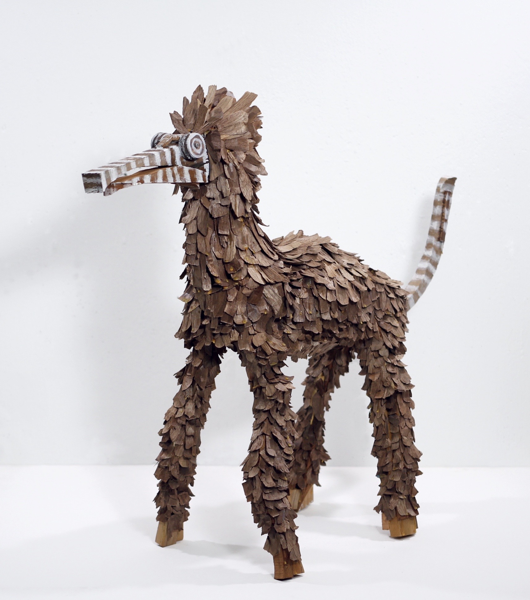 John Maloof, Feathered Dog, wood and walnut shavings